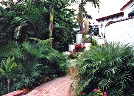 Spanish style home with tropical entryway